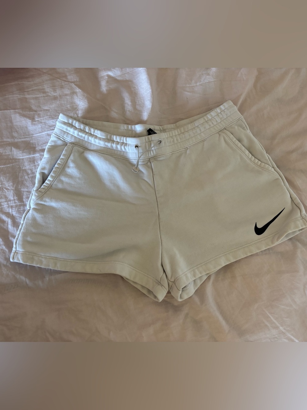 Nike Women's White Athletic Shorts with Black Swoosh
